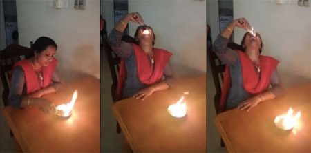 woman swallows fire ball