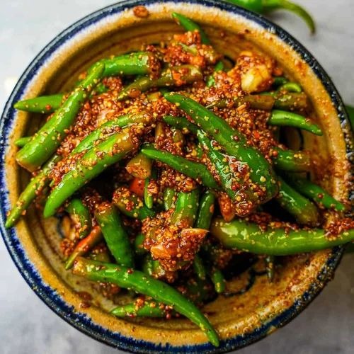 Make spicy green chilli pickle in grandmas style follow this very easy recipe A